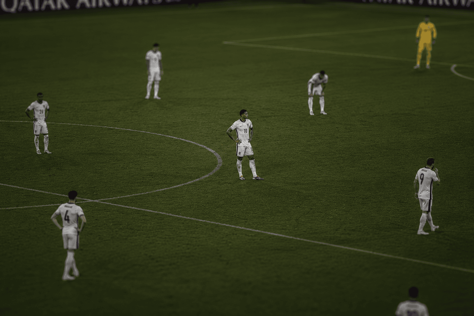 The burden of carrying England β Bellingham stands alone at the center circle while teammates scatter around him