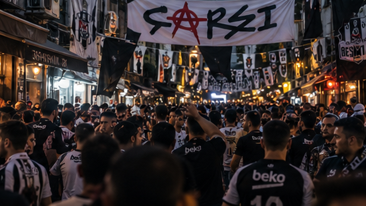 A packed alley in the Beşiktaş çarşı beneath a huge ÇARŞI banner, black-and-white flags and scarves strung overhead, the crowd in Beşiktaş colors